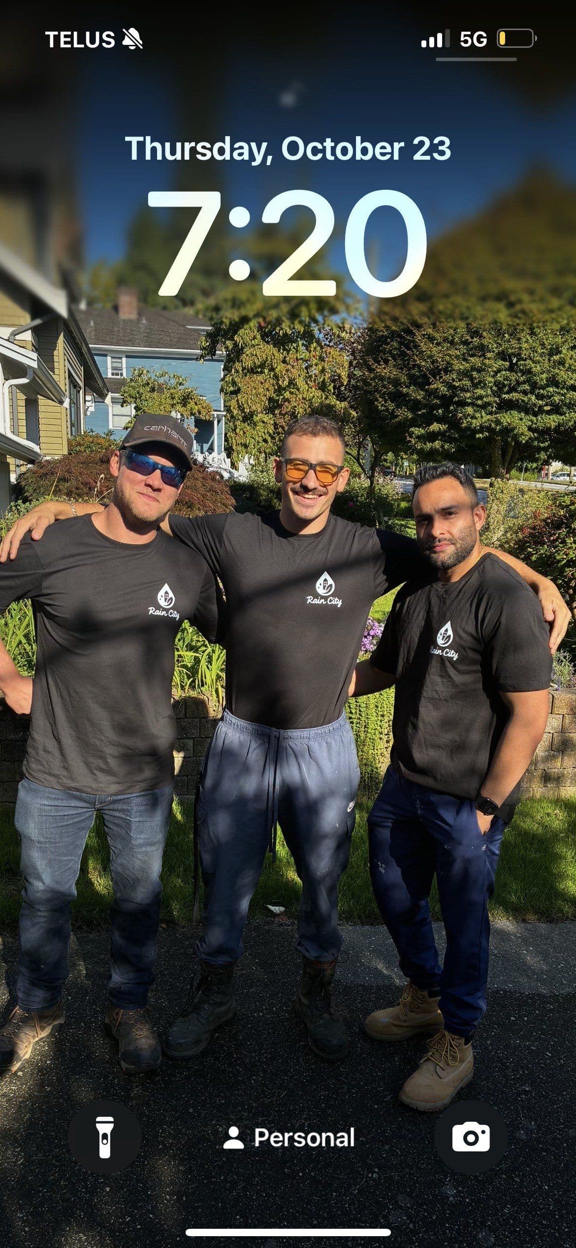 RainCity crew members in branded shirts on a job site